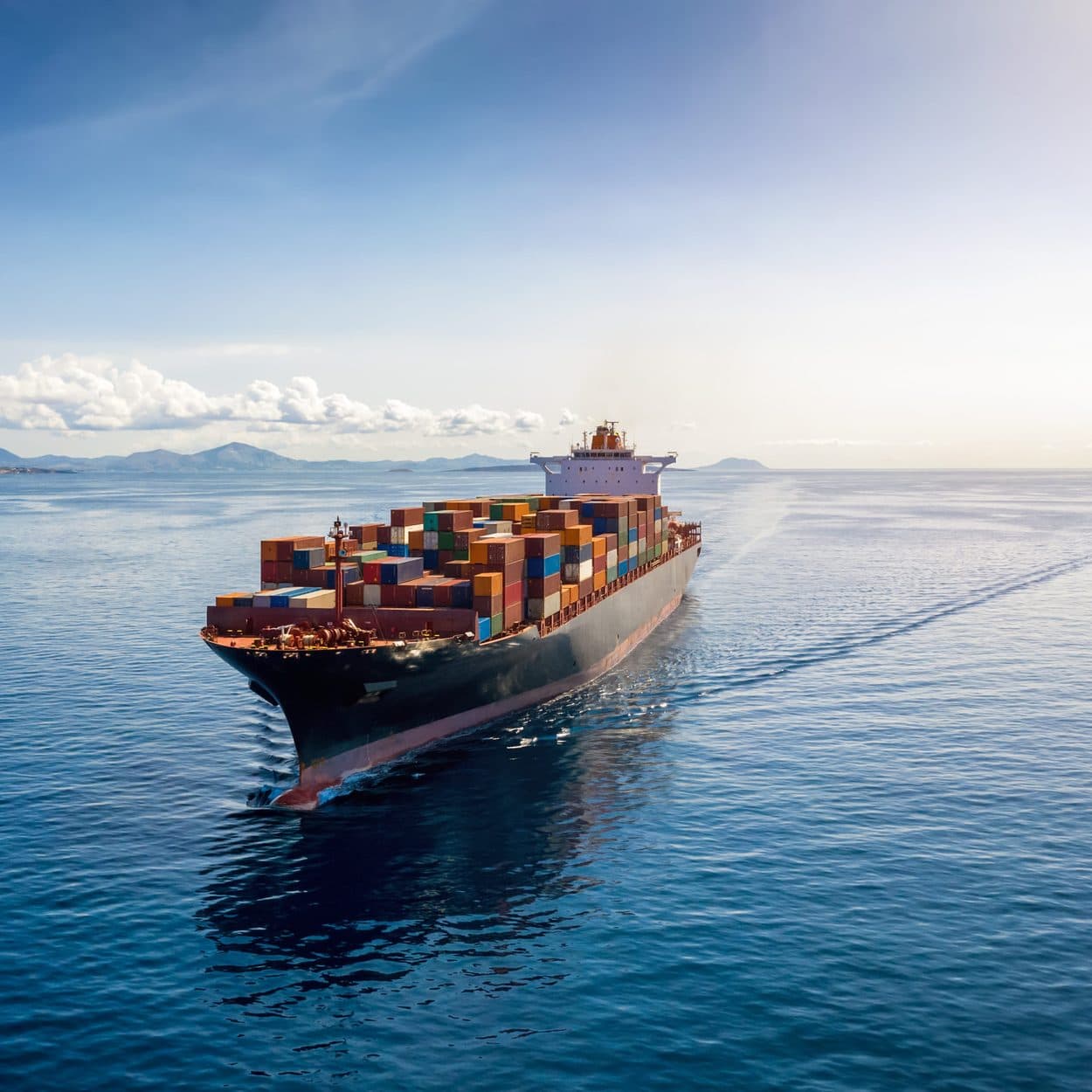 Cargo ship at sea carrying shipping containers